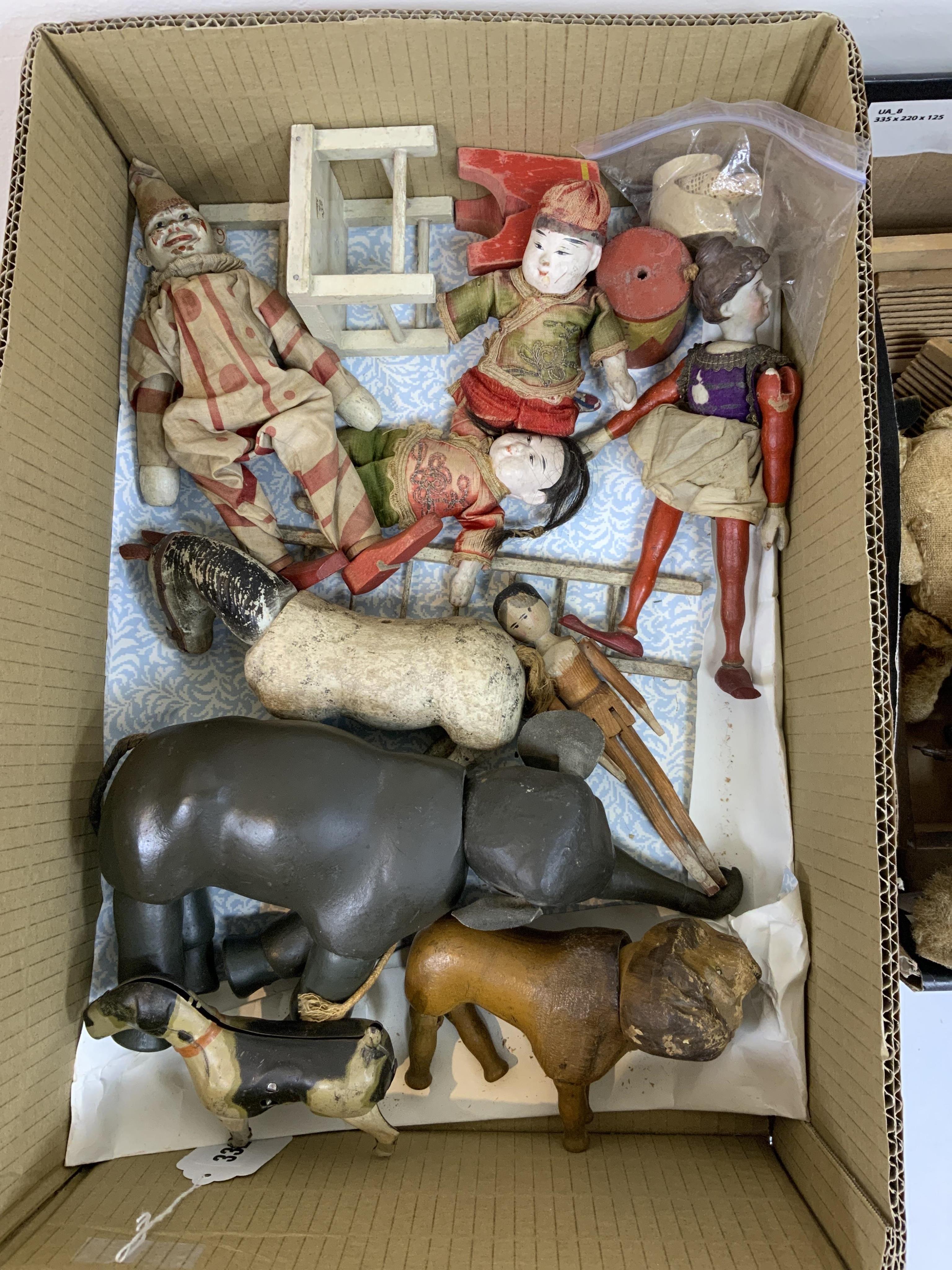 A Schoenhut Humpty Dumpty Circus, early 20th century, including elephant, lion house and other pieces, a playbarn (10) plus a peg doll and a German tinplate clockwork dog